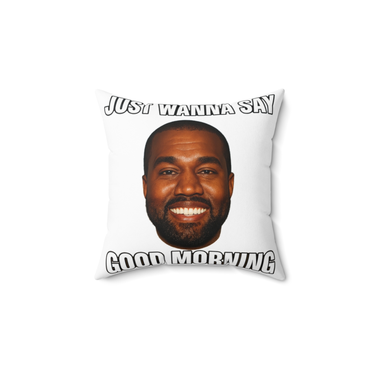 A square cushion with a portrait of a smiling man against a blue and yellow sky. The text "JUST WANNA SAY GOOD MORNING" is printed on the cushion in white letters.