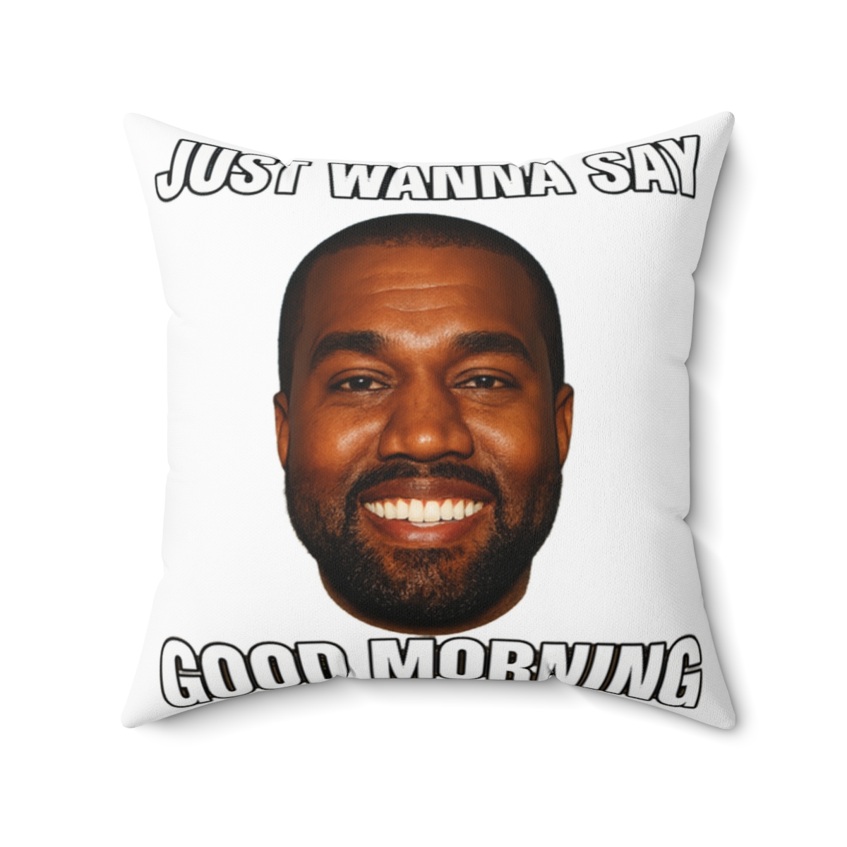 A square cushion with a portrait of a smiling man against a blue and yellow sky. The text "JUST WANNA SAY GOOD MORNING" is printed on the cushion in white letters.